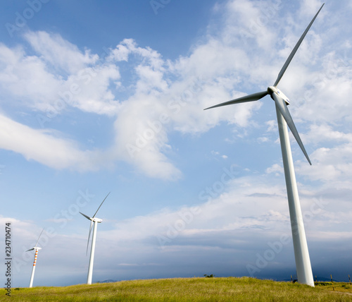 Wind blades on sweet hills photo