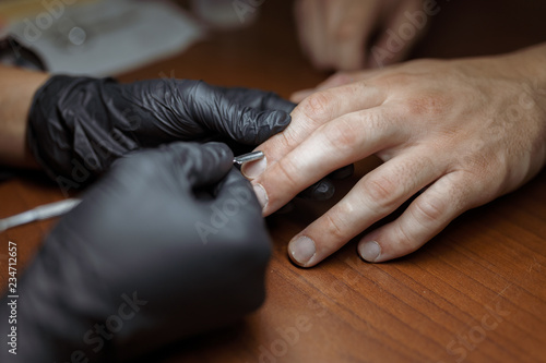 men's manicure close-up with a manicure specialist