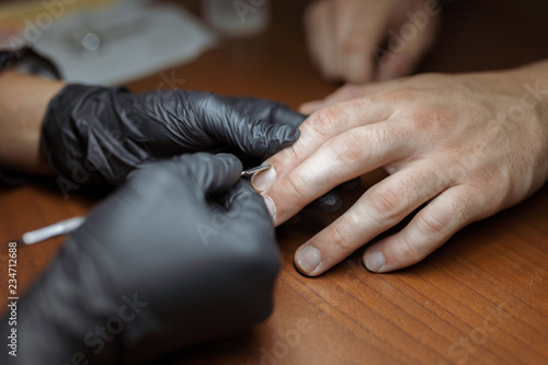 men's manicure close-up with a manicure specialist