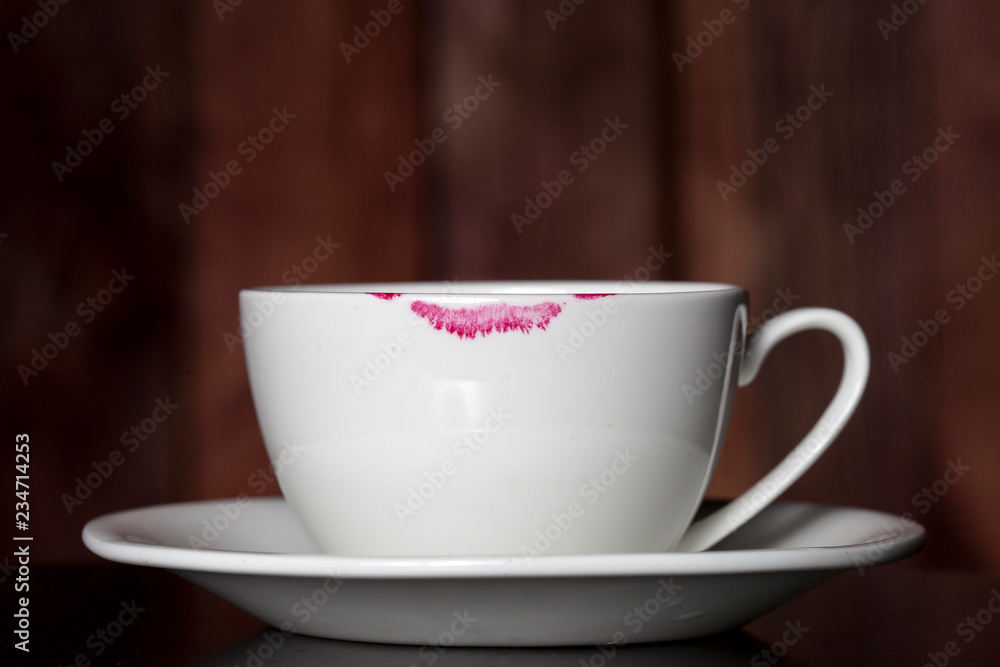 Trail of lipstick on a white cup