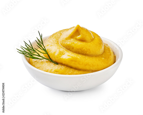 Fotografiet Yellow mustard with green dill isolated.