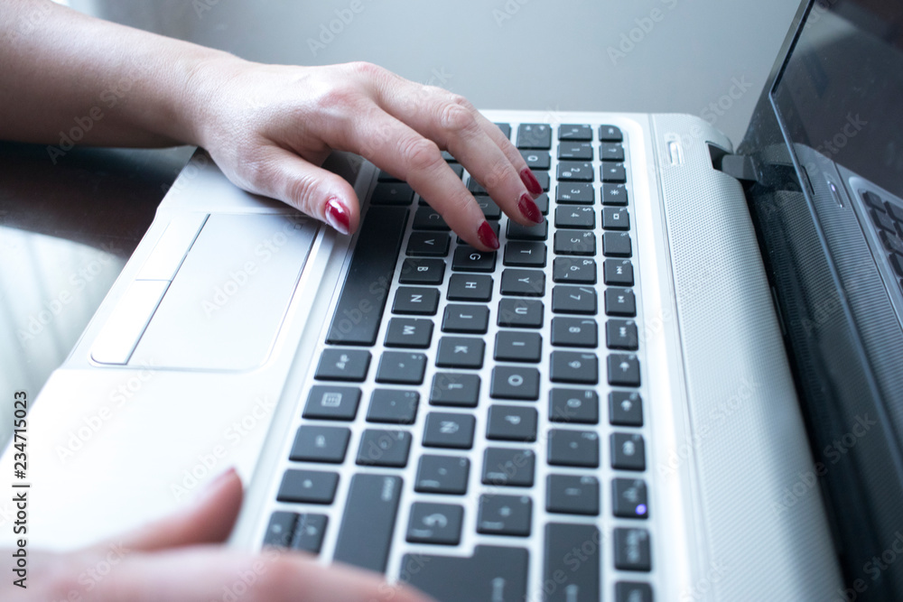 Woman typing on laptop pc Woman typing on laptop pc