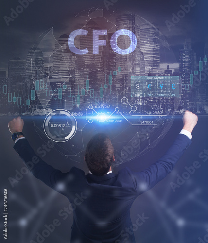 The concept of business, technology, the Internet and the network. A young entrepreneur working on a virtual screen of the future and sees the inscription: CFO