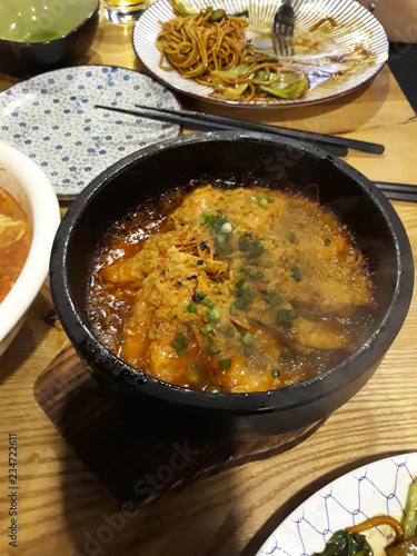 Chinese cuisine. A plate with boiling food.