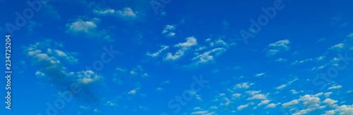 Panoramic photograph of blue sky with clouds © PLG