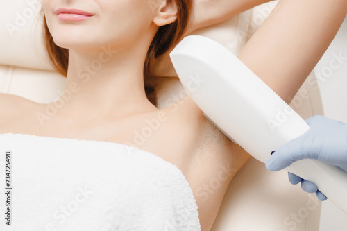 Smooth skin woman under arms. Laser hair removal photo
