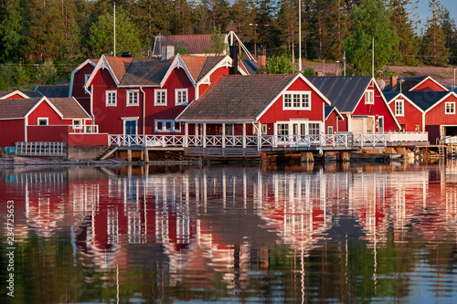 red houses at sunset in the fishing village of Norfaellsviken, Höga Kusten, Sweden