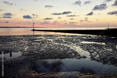 Sonnenuntergang bei Ebbe: Rippelwatt auf der Insel Baltrum, Niedersachsen, Germany photo