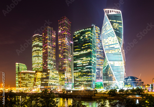 Skyscrapers in business center of Presnensky District, beside the Moscow River at night, Moscow, Russia photo