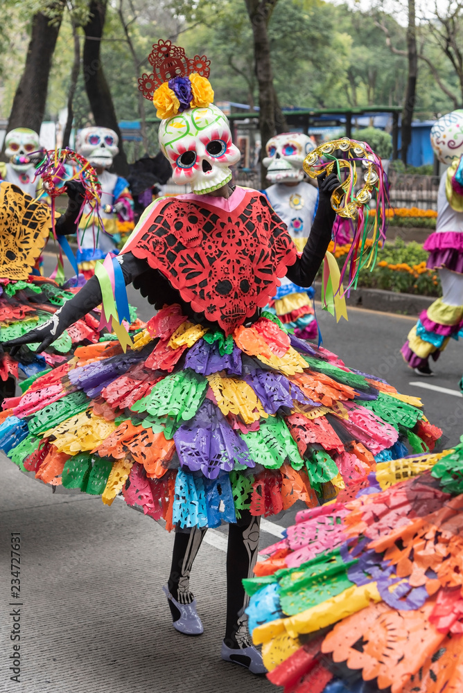 Participant unknown girl in the Day of the dead tradition in Mexico. Dancing specters with dead costumes