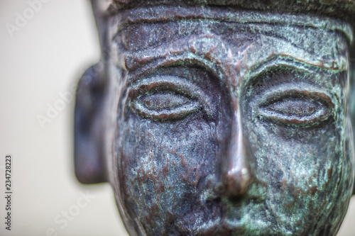 Melqart bronze figurine closeup photo