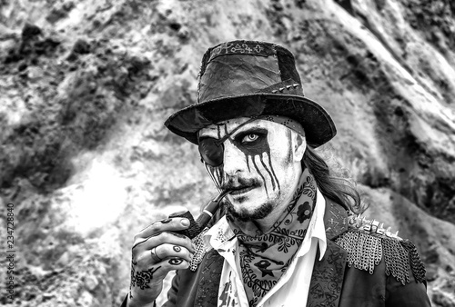 pirate rogue from the middle ages to smoke pipe, black and white photo