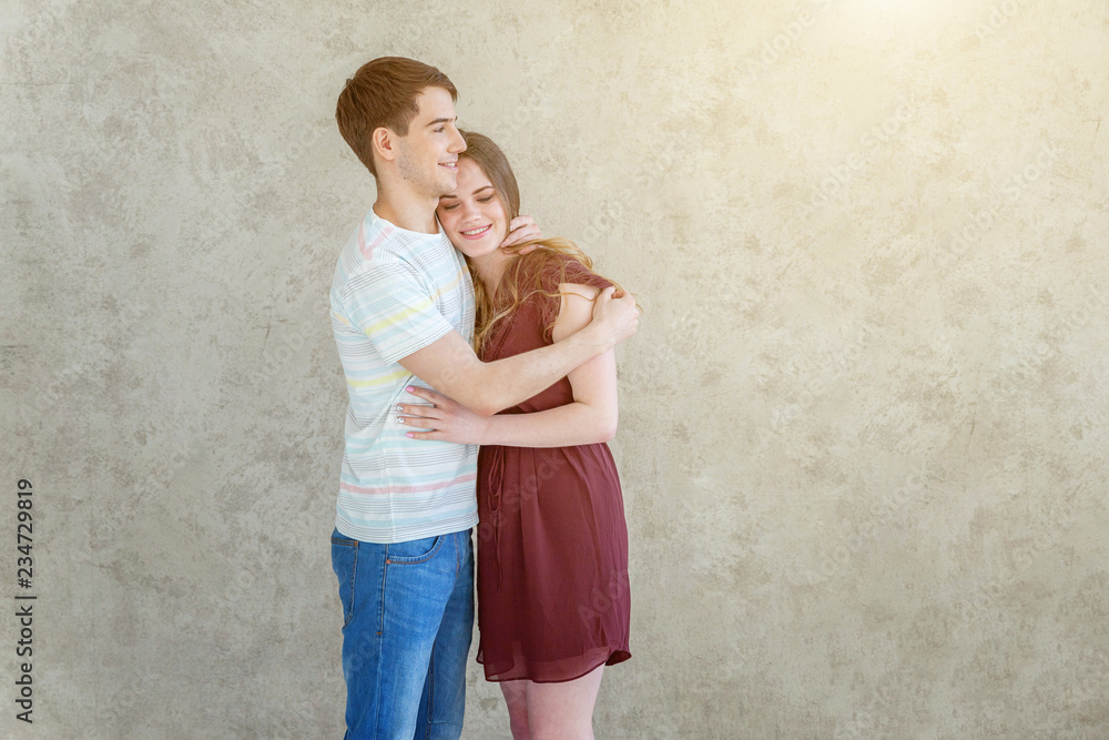 Romantic sexy couple in love having nice time together. Young woman hugging man, white light room background. Students, bride, groom, engagement, relationship, aspirations, supporting relying concept Romantic sexy couple in love having nice time together. Young woman hugging man, white light room background. Students, bride, groom, engagement, relationship, aspirations, supporting relying concept