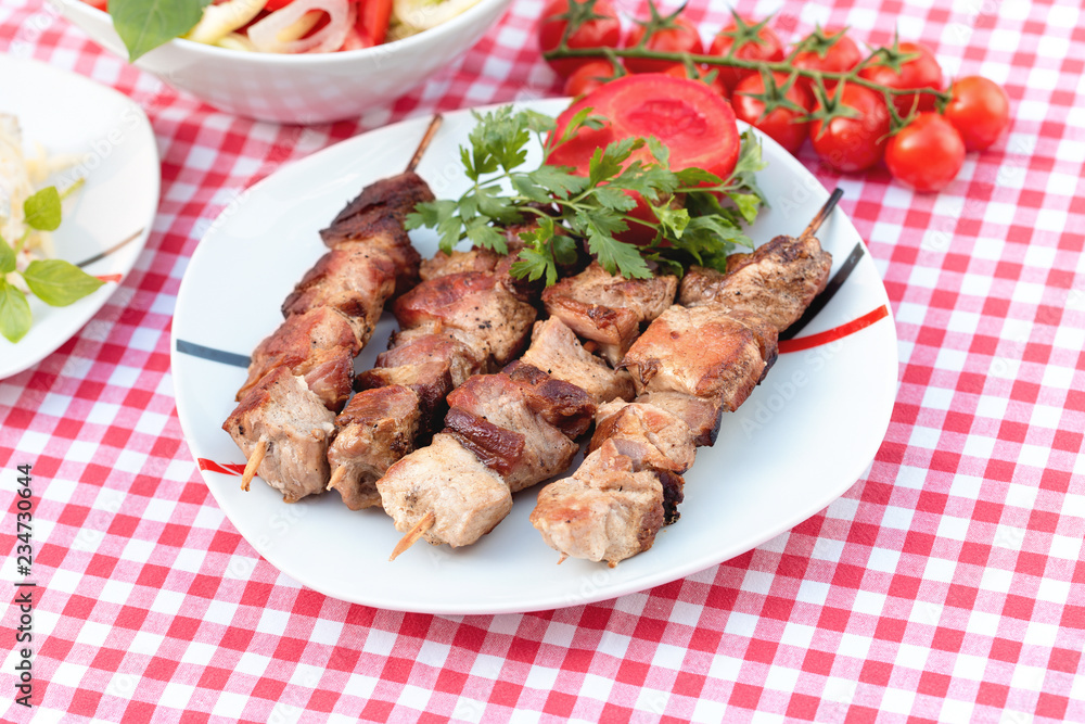 Grilled meat, grilled pork meat on plate - delicious meal (grilled skewers) Grilled meat, grilled pork meat on plate - delicious meal (grilled skewers)
