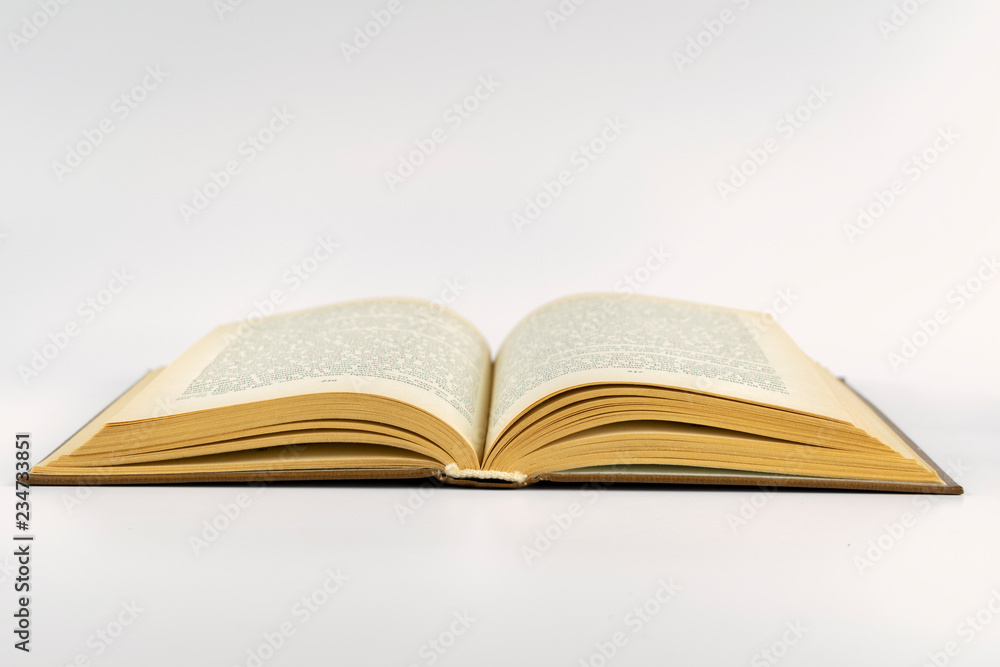 open book lying on a white background open book lying on a white background