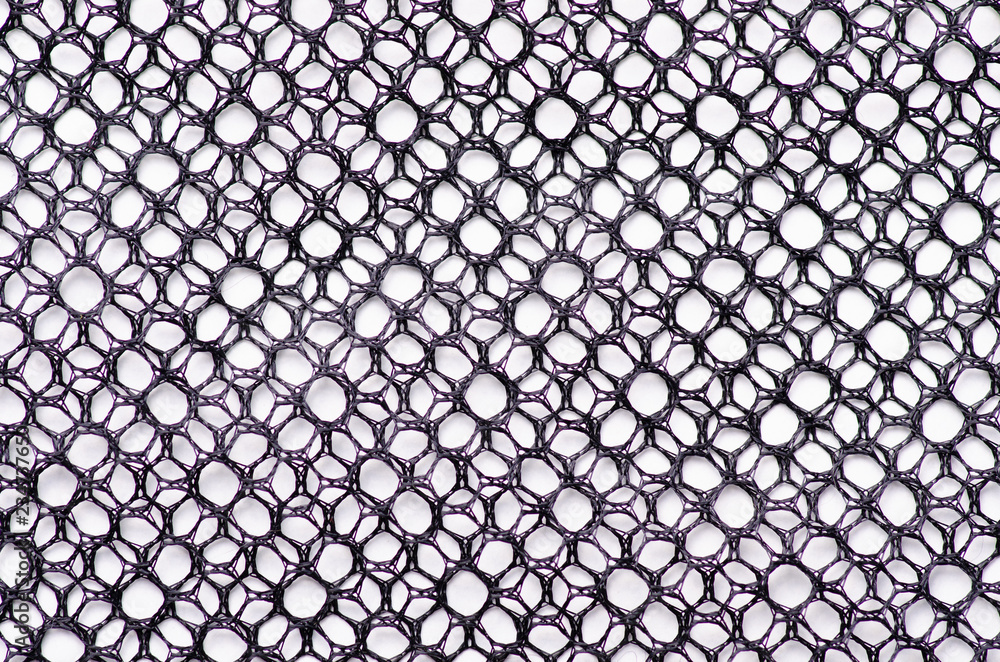 Black tracery mesh texture fabric macro on a white background Black tracery mesh texture fabric macro on a white background