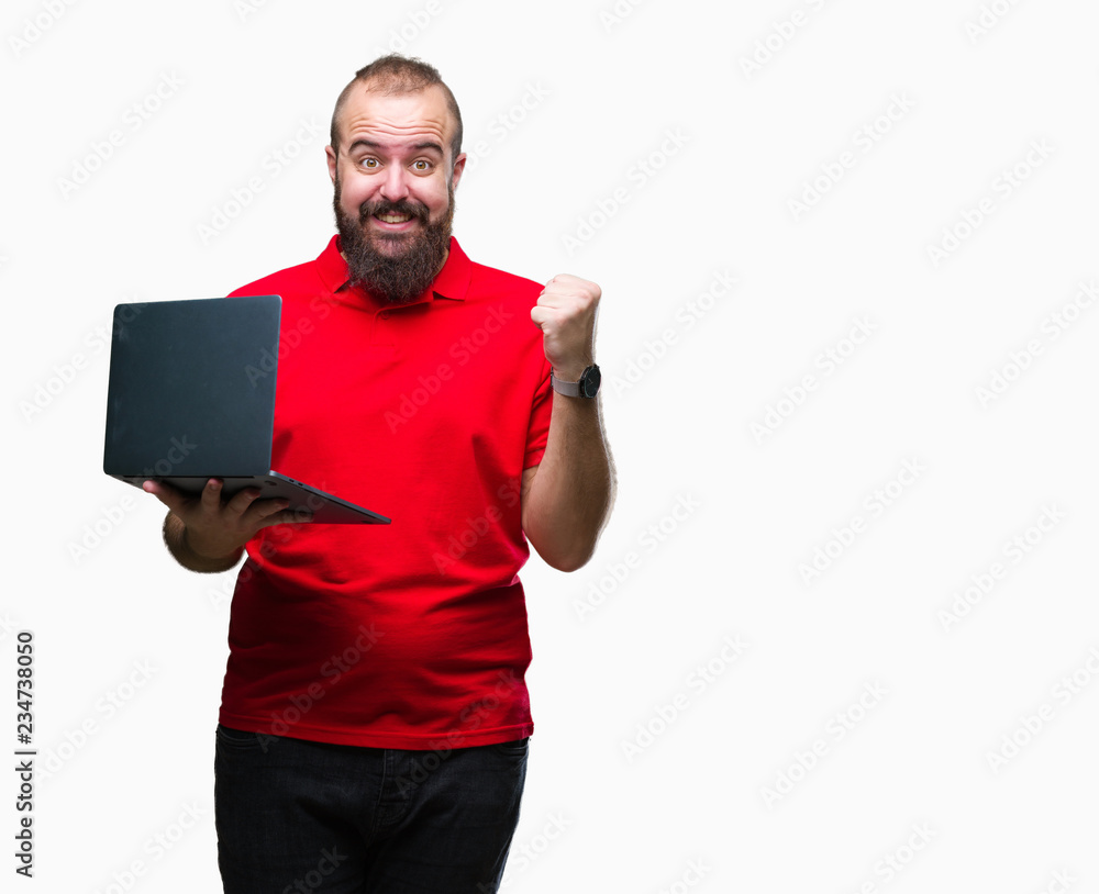 Young caucasian man using computer laptop over isolated background screaming proud and celebrating victory and success very excited, cheering emotion Young caucasian man using computer laptop over isolated background screaming proud and celebrating victory and success very excited, cheering emotion