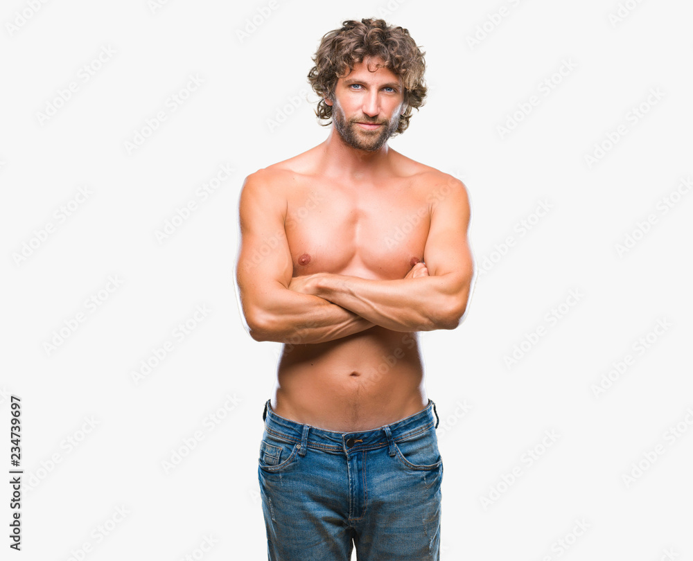 Fototapeta premium Handsome hispanic model man sexy and shirtless over isolated background happy face smiling with crossed arms looking at the camera. Positive person.