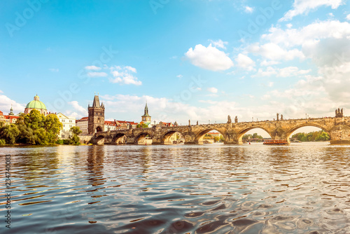 Prague, Bohemia, Czech Republic. Historic center included in the UNESCO World Heritage. View of the Vltava river and the Charles bridge with Old town bridge tower. 