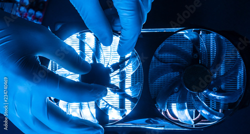 professional engineer in laboratory working with micro electronic cooler fan  f photo