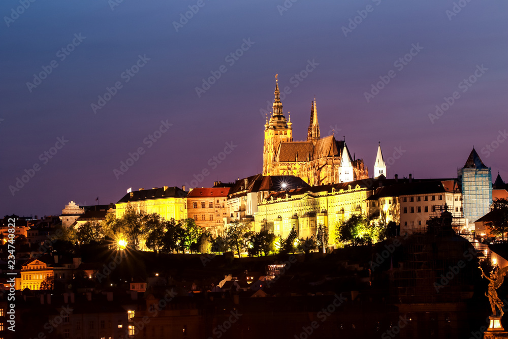 Prague, Bohemia, Czech Republic. Historic center included in the UNESCO World Heritage. The Metropolitan Cathedral of Saints Vitus in to the largest ancient castle. Night scene.