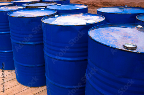 colored metal barrels. Blue oil drums containing fuel for transportation