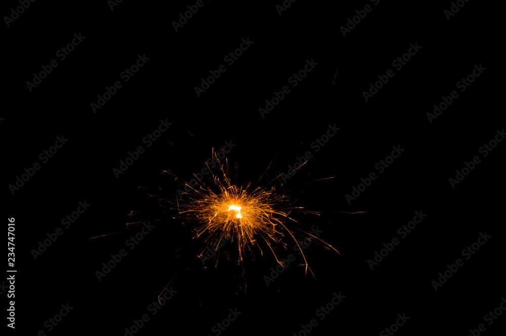 Christmas sparkler on black background. Bengal fire