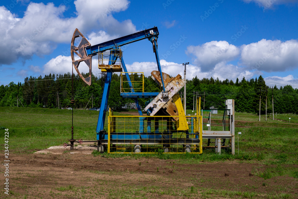 The beam pumping unit is homework, sunset in oil field. Oil pump oil rig energy industrial machine for petroleum. The pumping unit as the pump installed on a well. Equipment of oil fields. The beam pumping unit is homework, sunset in oil field. Oil pump oil rig energy industrial machine for petroleum. The pumping unit as the pump installed on a well. Equipment of oil fields.