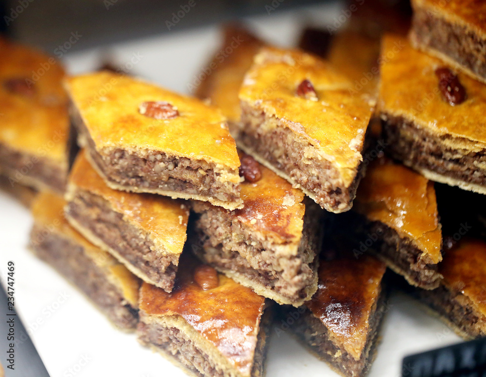 Photo of bright tasty sweet baklava with nuts