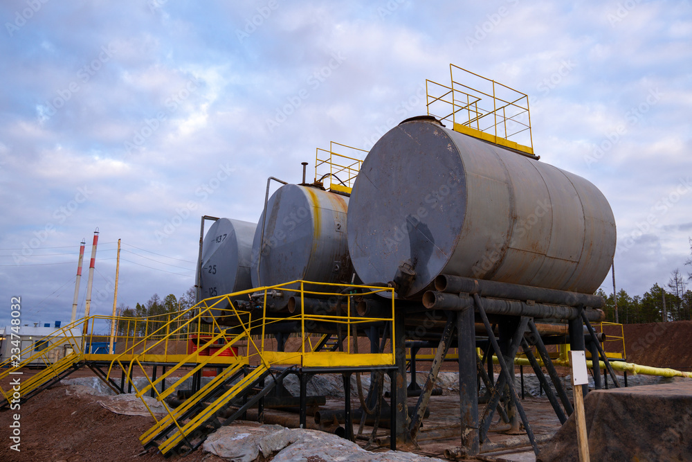 Fototapeta premium Oil industry. Oil Storage Tanks for petroleum products at the refinery. Septic tanks will bring down the use of underground water treatment plant.