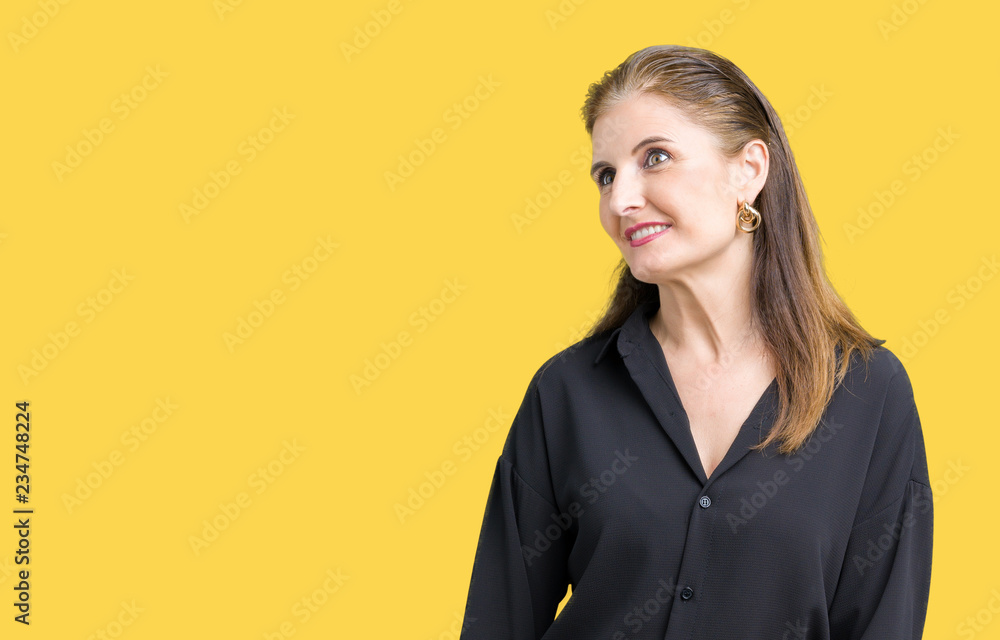 Beautiful middle age mature business woman over isolated background looking away to side with smile on face, natural expression. Laughing confident. Beautiful middle age mature business woman over isolated background looking away to side with smile on face, natural expression. Laughing confident.