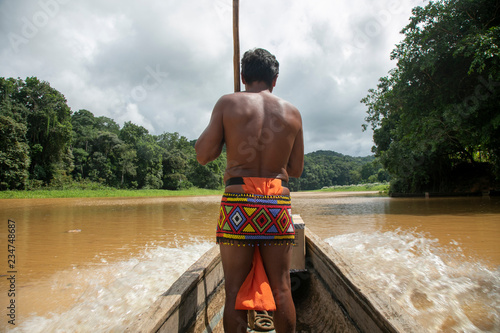  Indigenous Embera in boat crossing the river, Gamboa Panama