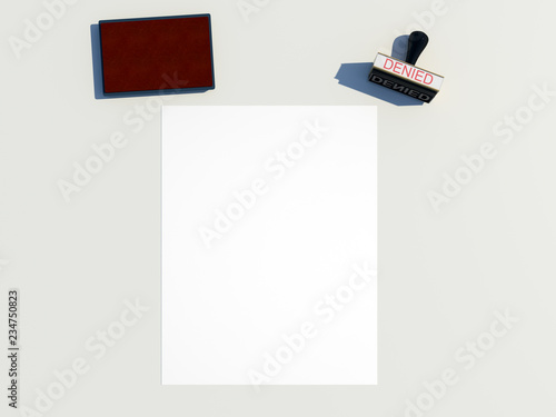 white blank paper us letter size traditional custom wooden rubber stamp with denied label on impression area red stamps felt pad on table top down view copy space design template 3d illustration