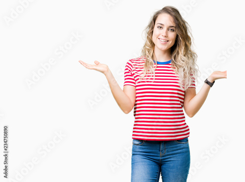 Beautiful young blonde woman over isolated background Smiling showing both hands open palms, presenting and advertising comparison and balance