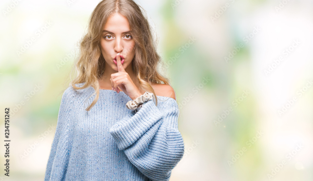 Beautiful young blonde woman wearing winter sweater over isolated background asking to be quiet with finger on lips. Silence and secret concept. Beautiful young blonde woman wearing winter sweater over isolated background asking to be quiet with finger on lips. Silence and secret concept.