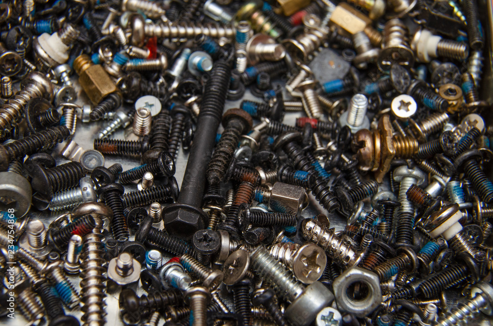 lots of little screws and bolts from kompjuteroa and Smartphone, macro lots of little screws and bolts from kompjuteroa and Smartphone, macro