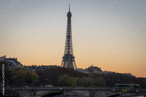 Paris, France - 11 18 2018: panoramic view of Paris and the Eiffel Tower from the Alexander III bridge at sunset © Franck Legros
