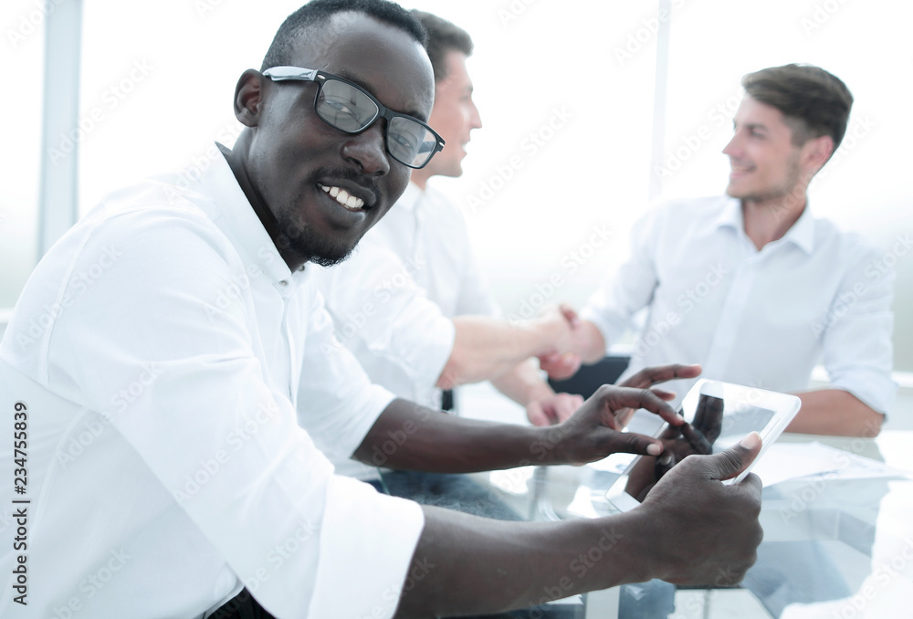 close up.businessman sitting at the office Desk. close up.businessman sitting at the office Desk.
