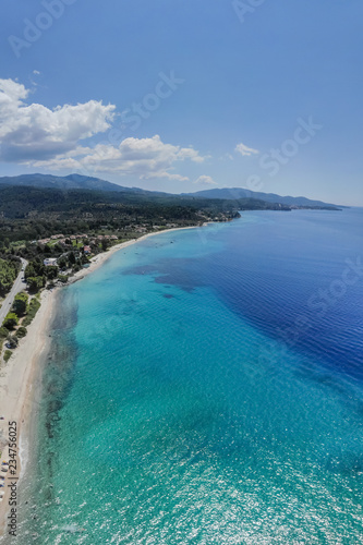 Drone aerial view of sea shore, sandy beach and blue water