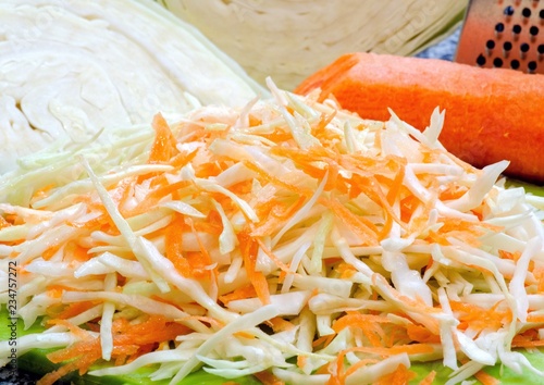 Raw chopped cabbage and shabby carrot, salad ingredients, raw vegetables
