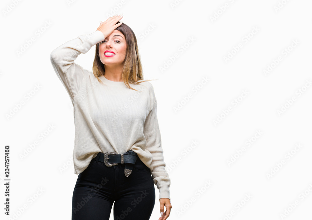 Young beautiful woman casual white sweater over isolated background surprised with hand on head for mistake, remember error. Forgot, bad memory concept. Young beautiful woman casual white sweater over isolated background surprised with hand on head for mistake, remember error. Forgot, bad memory concept.