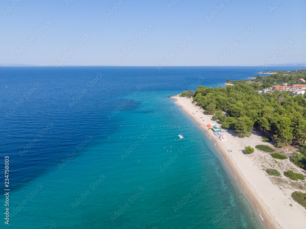 Fototapeta premium Drone aerial view of sea shore, sandy beach and blue water