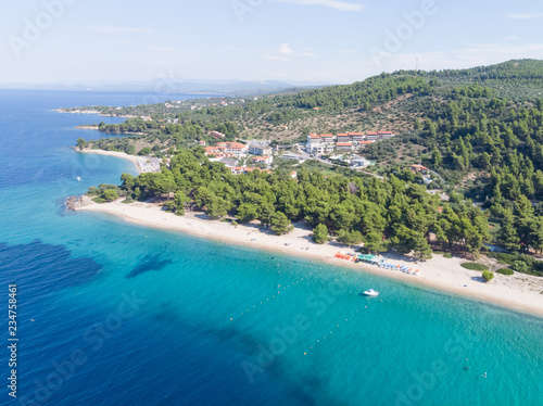 Drone aerial view of sea shore, sandy beach and blue water