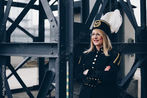 Obraz na płótnie Woman black coal miner foreman in gala parade uniform w salonie