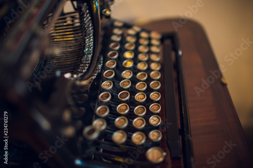Fotografía Old typewriter on wood on a blue background.