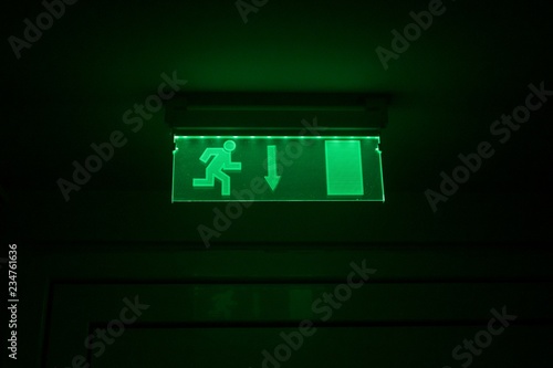 Emergency fire green glass exit door night sign