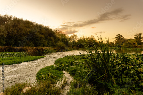 Sunset over the river sorraia  as it flows in Biscainho, Coruche