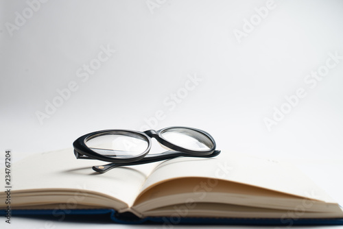Notebook with glasses and pen, Book with glasses, Blue notebook with glasses, Book with cup of tea