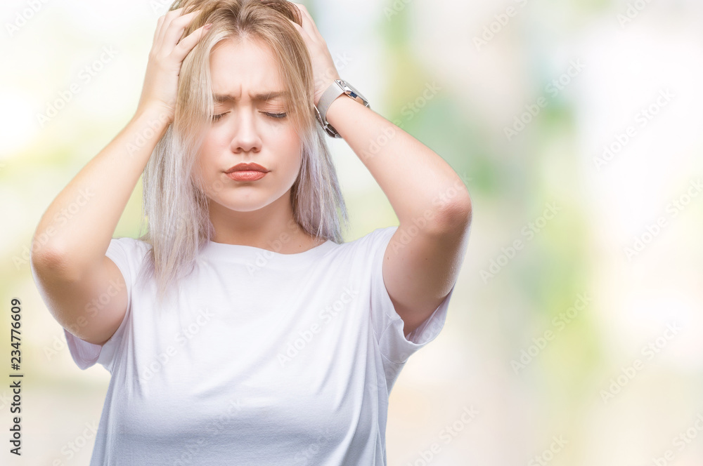 Young blonde woman over isolated background suffering from headache desperate and stressed because pain and migraine. Hands on head.