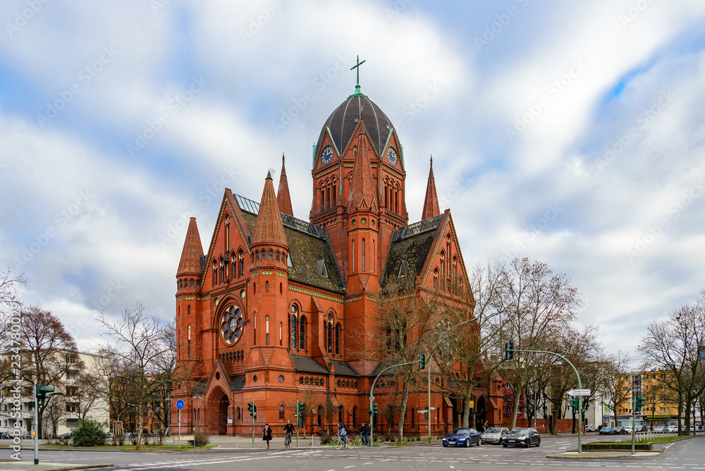 Obraz premium Evangelische Kirchengemeinde, Beautiful church with red stone facade in Kreuzberg, Berlin, Germany in winter season.